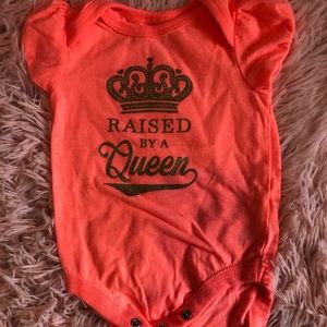 “Raised By A Queen” Onesie